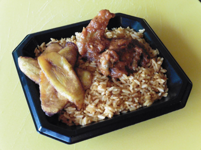 Jollof Rice with fried plantains, chicken and “stew.”