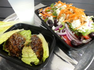 Wrapway looks to build fans among Charlotte’s vegetarians and vegans with its grainburger (Turkish kofta, left), Greek Village salad (right), and a traditional yogurt drink called ayran.