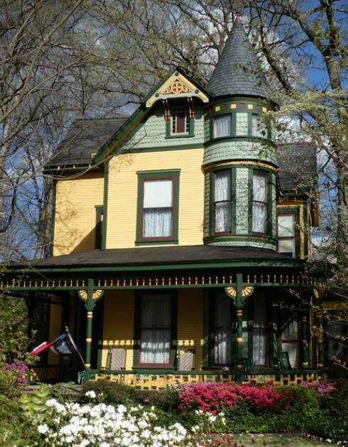 One of the most-photographed Victorian Era houses in the Southeast, thanks to loving restoration by Fran and Bill Gay, who began in 1973 when this was a run-down rooming house. It started life in the 1890s on North Tryon Street, one of two identical houses built for the sons of merchant R.M. Miller. In 1915 mule teams pulled it out here to Charlotte's fashionable new suburb.