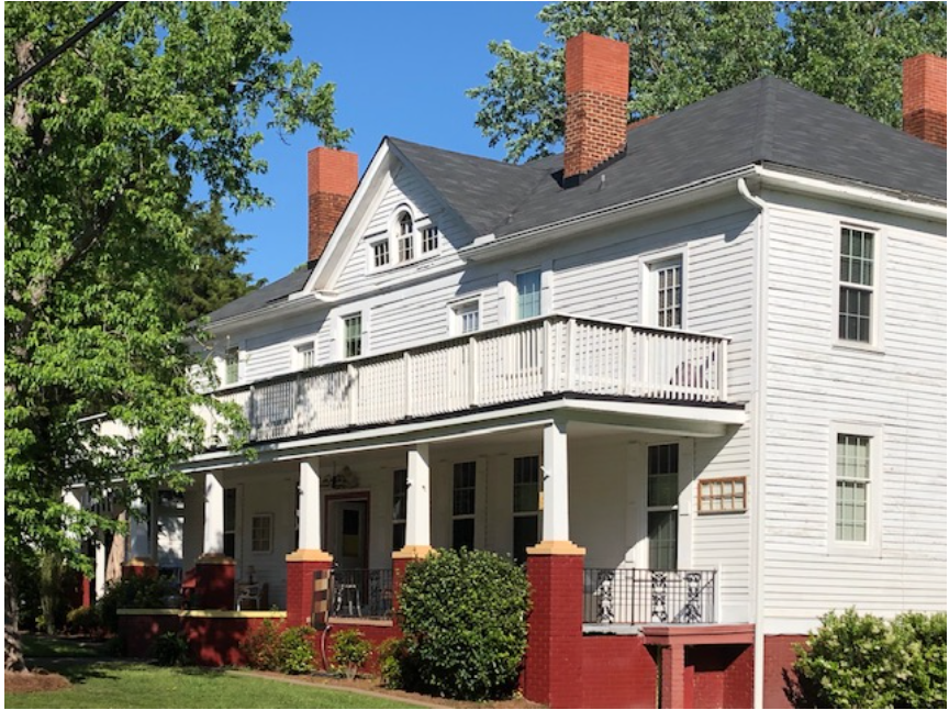 Stuart Cramer’s original plan for North Charlotte called for a hotel. Its construction began in June of 1903 near the start of the district’s development. Salesmen calling on North Charlotte businesses stayed here, along with unmarried mill workers and couples not yet ready to rent an entire house. Mrs. George Shue ran it for the Highland Park company, providing not just rooms for her lodgers but also “board” – home-cooked meals.